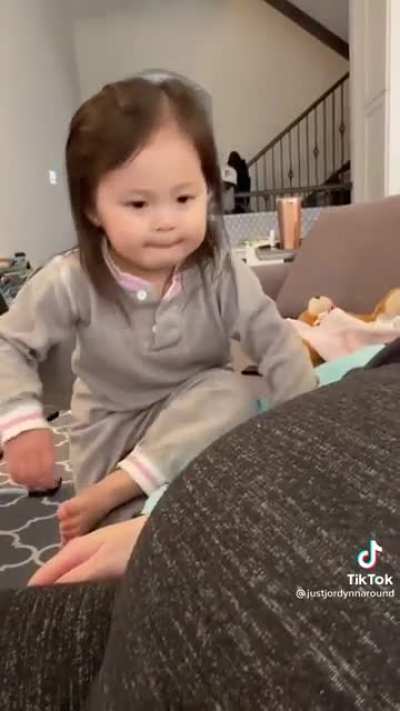 Li' girl reacting to unborn sibling.