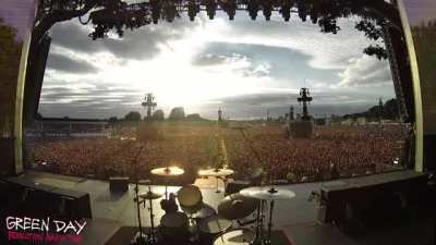 Crowd sings Bohemian Rhapsody before Green Day concert begins.