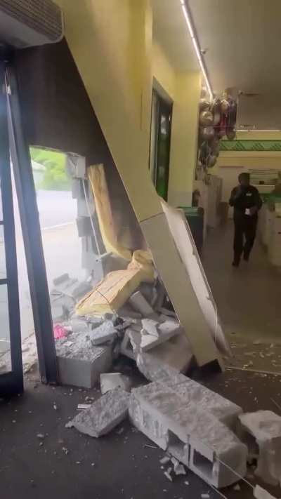 Car rams lady into Dollar Tree and she casually walks off then a fight breaks out in then parking lot.