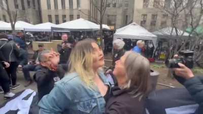 Scuffle with MAGA woman triggered by banner outside Manhattan court house that reads "Trump Lies All the Time"