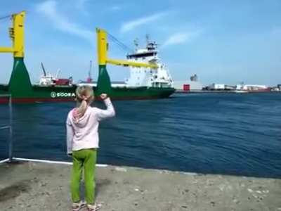 Girl honks at ship