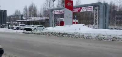 A bear chasing men in the middle of the Russian city got hit by the bus.