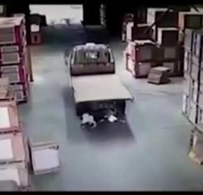 Riding a bicycle in a factory.