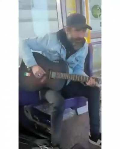 Irish street performer sings 'You've Got a Friend in Me' to autistic child on public transport