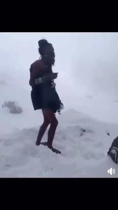 Sadhus in the Himalayas worship Lord Shiva in the snow.