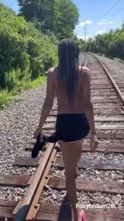 Me and my brother playing on the train tracks he painted my face as a prank