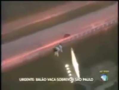 Translation: "Urgent! Balloon cow fly over S&atilde;o Paulo."