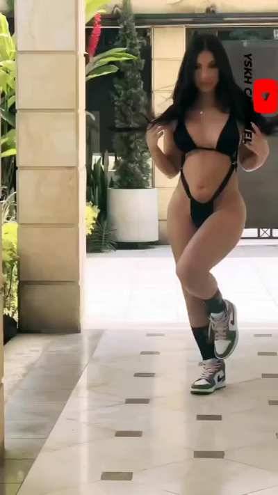 Camila Moreno in black swimsuit