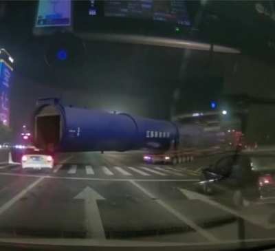 Petite white car gets plowed by BBC (big blue cylinder)
