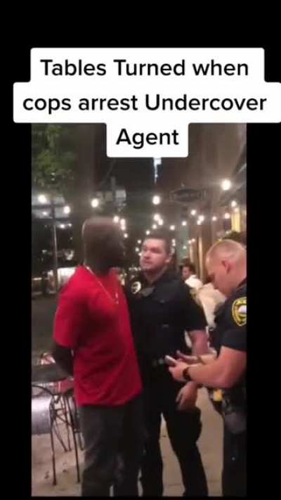 2 Cops didn't know he was undercover agent and made a big mistake by trying to arrest him, thinking he was suspicious.