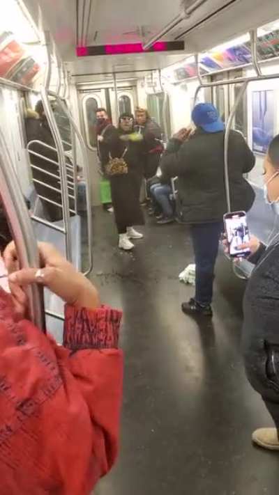 Woman attempts to stab man with a bottle on NYC subway