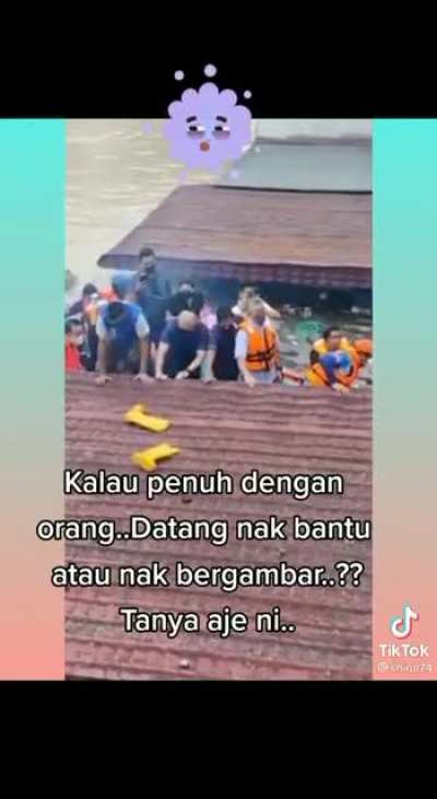 Finance Minister conducting "rescue", in a boat full of personnel