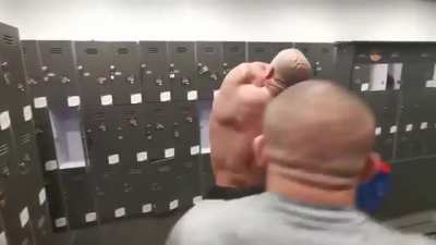 Bodybuilder can&rsquo;t reach the sticker on his back