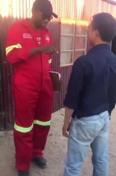 Chinese man belittles Namibian man and says he is on ‘Chinese land’. This takes place in Nambia.
