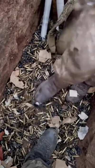 Due to russia's endless human wave attacks Ukrainians have to dig deeper trenches... as the current ones are filling up with machine gun bullet casings