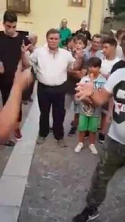 A very aggressive session of "Morra", an Italian game of throwing hands and shouting numbers