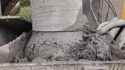 Bottom of Conveyor Chute into Slip Form Hopper