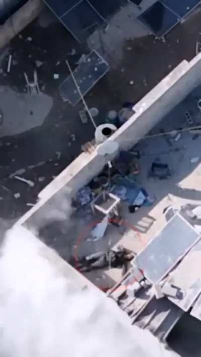 Jebaliah: Injured Hamas militant attempts to shoot at IDF troops from a rooftop, gets sprayed in the face. His friend picks up his gun and continues firing, gets sprayed in the face too