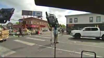 Reporter comes under fire at the George Floyd memorial in Minneapolis. One person is being treated at the hospital after being shot.