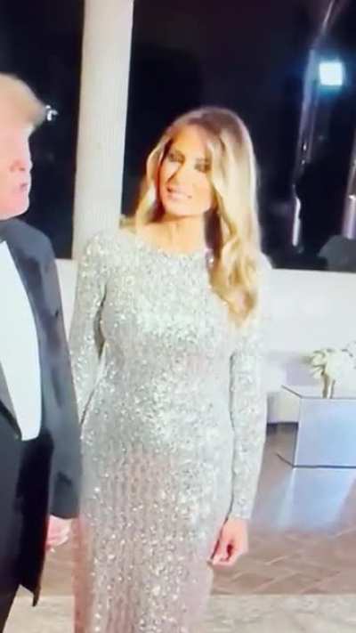 Melania Trump using every ounce of will power she can muster to smile for half a second while holding Donald Trump&rsquo;s tiny hand.