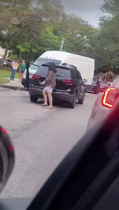 Driving up from behind the line and stopping oncoming traffic in the middle of a school zone to try to cut back in ahead of the line