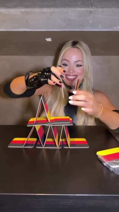 Liv attempting to make a house of cards pyramid | 2/26/2026