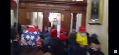 Another extended angle of the woman getting shot in the capitol building