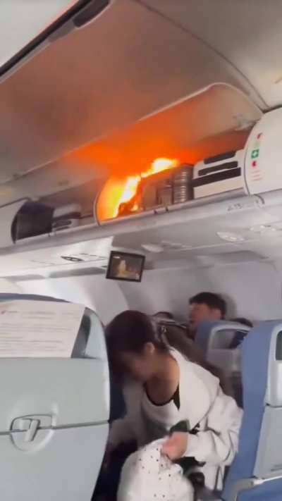 lithium battery in a passenger&rsquo;s overhead bag caught fire