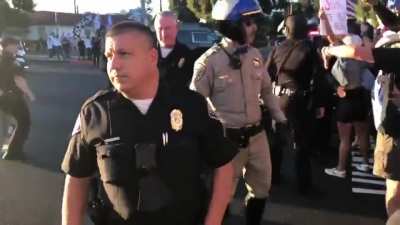 Crowd screams &ldquo;fuck you&rdquo; and &ldquo;traitor&rdquo; at the US president's motorcade during a visit to Long Beach, CA