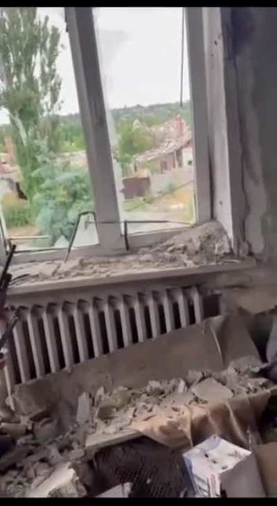 Russian soldier with a radio sensor / warning device shoots down a drone with a shotgun, after a while the payload explodes on its own