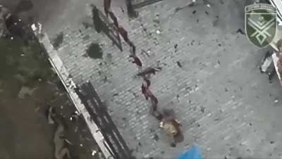 Russian soldier hit by dropped grenade crawls away leaving long trail of blood, until succumbing to his injury