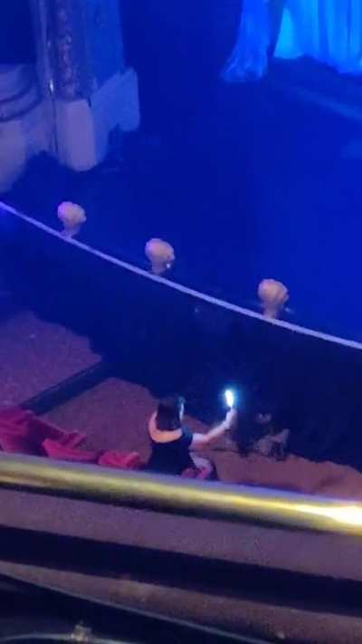"Influencer" using super bright ring light moments before a show starts in nice theater (oc)