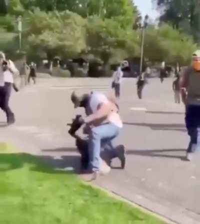 Proud Boys throw woman to the floor, pin her there, and attack her