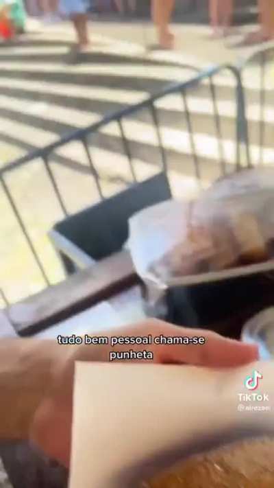 Tourist delights himself with a traditional Brazilian snack, the punheta 😋😋 uma del&iacute;cia