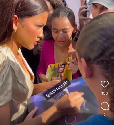 Zendaya signing autographs