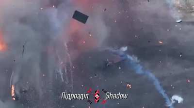 Ukrainian "Shadow" unit drops a M67 grenade into an abandoned russian T-80BV tank. The resulting ammo detonation sets another abandoned russian T-80BV a few metres away on fire.