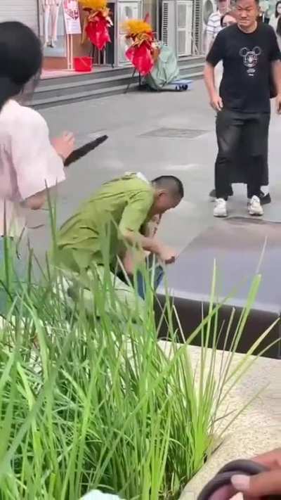 crazy man holding girl hostage with scissors