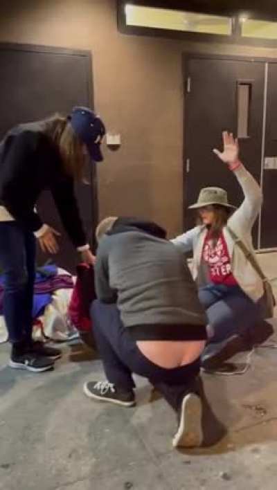 Crazy antimask covidiot Evangelical fanatics decided to violate covid safety measures and put on a maskless "concert" in LA's skid row homeless quarters. Here some of them are praying over (harassing) a homeless guy. They're superspreading the virus among