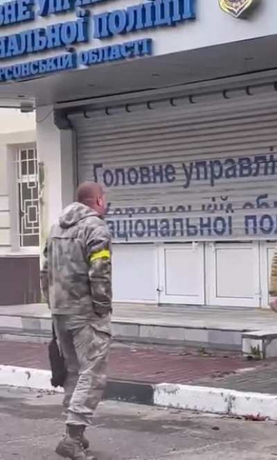The Ukrainian flag is raised on the building of the police headquarters in Kherson.