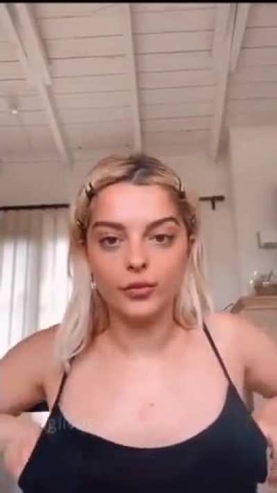 Adjusting her boobs