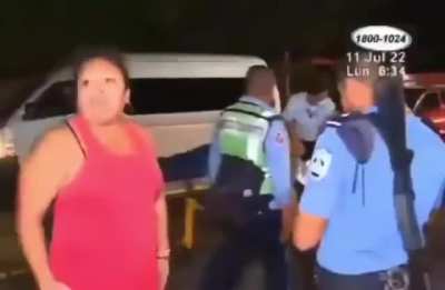 Woman beats guy being carried away by paramedics. Someone calls her stupid.