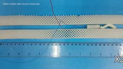 A robot which can move forward or backward by producing a continuously advancing wave. The robot has a unique minimalistic mechanical design and produces an advancing sine wave, with a large amplitude, using only a single motor but with no internal straig