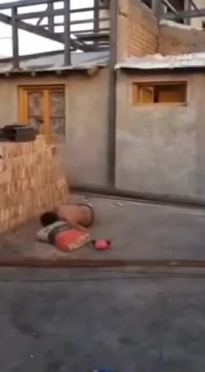 Throwing bags of mortar mix at a construction site