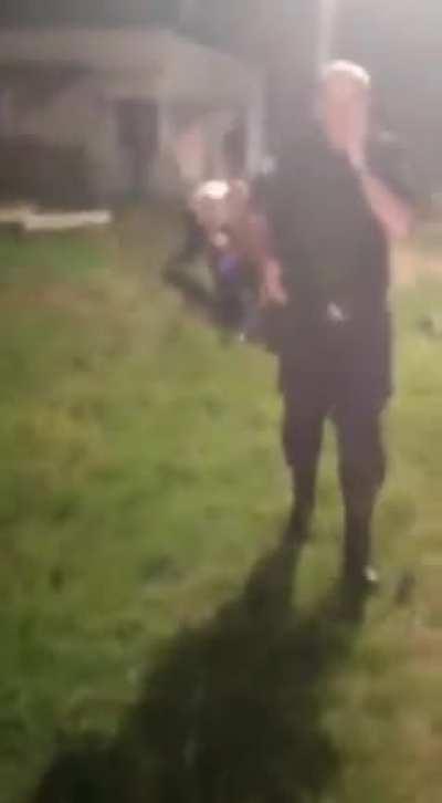 Guy fly kicks a policeman during a fight