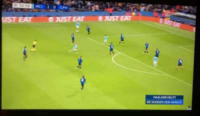 The ref drops his spray foam and haaland picks it up in the middle of the attack and quickly hands it back.