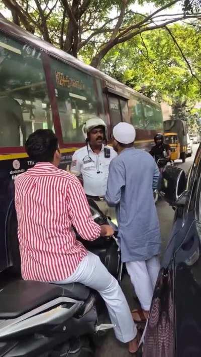 Scooter Riding on Wrong Side Without Helmets Sparks Heated Exchange with Traffic Police in Bengaluru