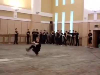 Russian guy squat kick dancing insanely fast
