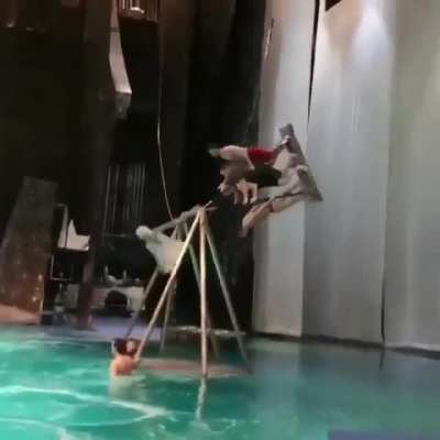 Triple flip off a pendulum swing