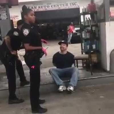 This guy trying to offend the police officer by repeatedly calling her the "n" word. Absolutely unacceptable!