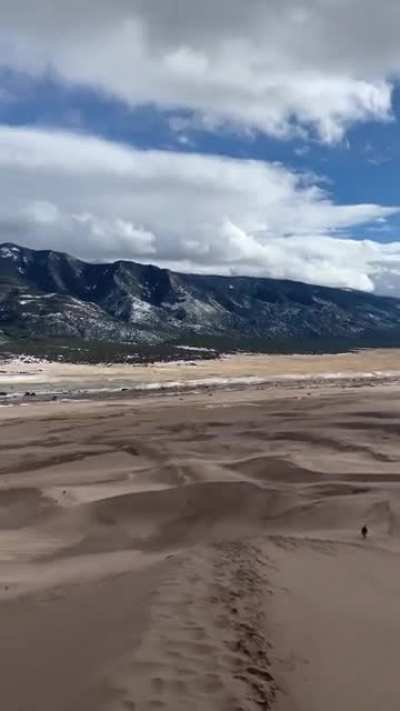 First time I&rsquo;ve ever seen sand dunes touching mountains 🏔Colorado, you are insane.